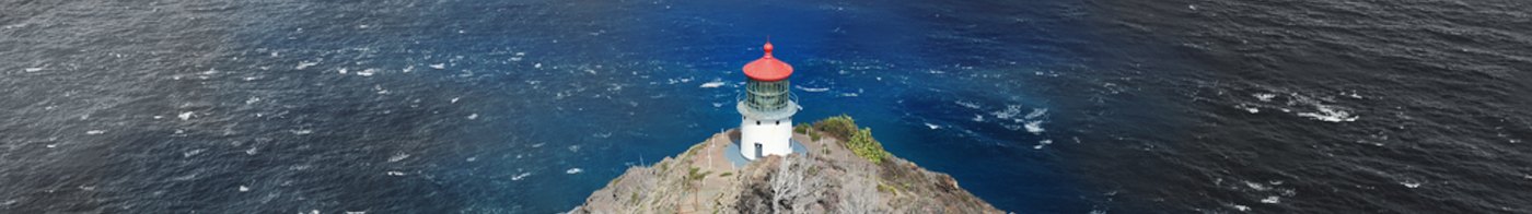 Lighthouse on a cliff above the open sea