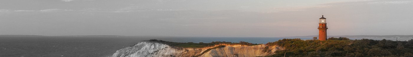 Lighthouse on a headland in the evening sun